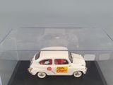 a small white car in a clear display case