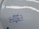 a close up of a plate with a blue and white design on it