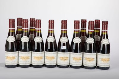 six bottles of wine lined up in a row on a table