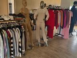 several mannequins are lined up in a clothing store