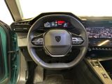 the interior of a car with a steering wheel and dashboard