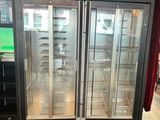two glass doors that are open in a store