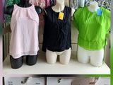 a display of clothes on a shelf in a clothing store