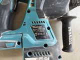 a cordless drill and a cordless hammer on the floor