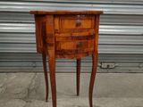 an image of a small wooden table with a drawer on it