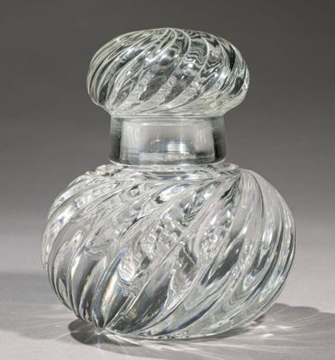 a clear glass jar with a swirly design on it