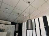 two lamps hanging from the ceiling in a room