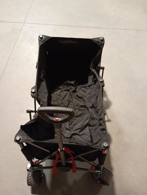 a black cart with a black cover on it