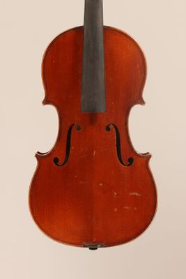 an old violin with a bow hanging from it ' s back