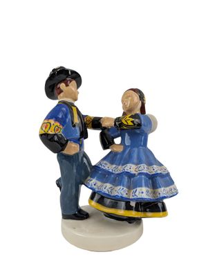 a figurine of a man and a woman dancing