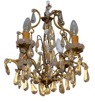 a chandelier that has a lot of lights hanging from it