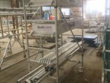 a picture of a large warehouse with a lot of scaffolding