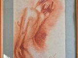 painting of a nude woman in a wooden frame on a wall
