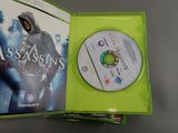 the box for the xbox game assassin ' s creed is open
