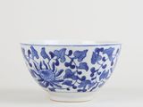 a blue and white bowl with blue flowers on it
