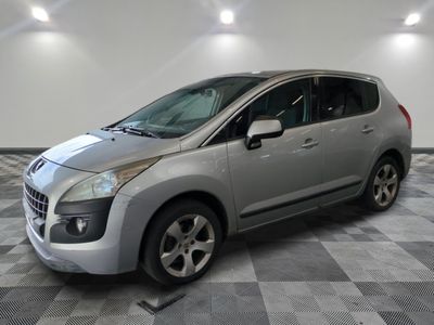 a picture of a silver car parked in a garage