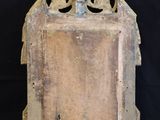 an old wooden box with a metal handle on a black background