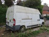 a white van that is parked on the side of the road
