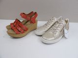 two pairs of women ' s shoes with red straps and white soles