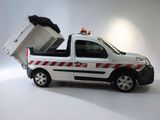 a small white truck with a dumpster in the back