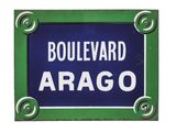 a picture of a blue and green street sign with the word boulevard arago