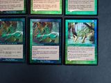 several cards of different colors and designs on a black surface