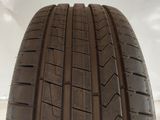 a close up of a tire on a white surface