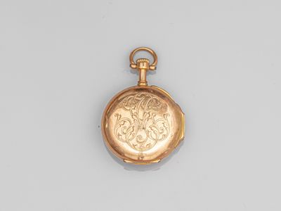 an antique gold pocket watch with a chain on a white background