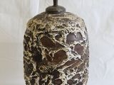 a lamp that is sitting on a white surface