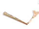 a wooden stick that has a pencil in it