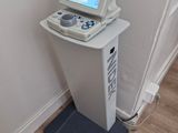 a small computer sitting on top of a stand