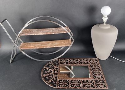 a table with a mirror, a lamp, and a picture frame