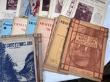 a lot of books on a table with a white table cloth