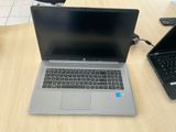 two laptops that are sitting on a table
