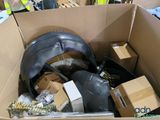a cardboard box filled with assorted items in a warehouse