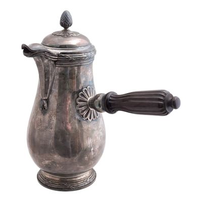 a silver coffee pot with a wooden handle on a white background