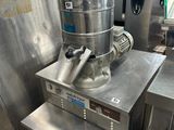 a machine that is sitting on a table in a kitchen
