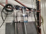 many tools hanging on the wall in the garage