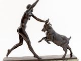 statue of a woman and a bull on a marble base