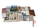 a lot of books that are sitting on a table