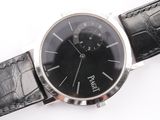 a watch that is sitting on a black leather strap