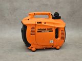 an orange and black portable generator sitting on top of a gray surface