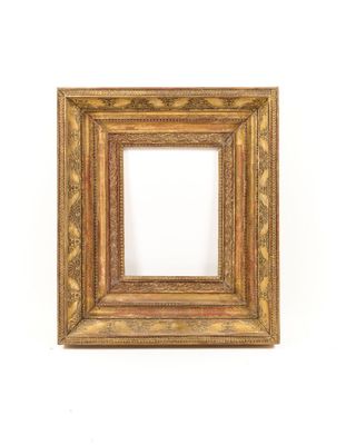 an old picture frame on a white wall with a white background