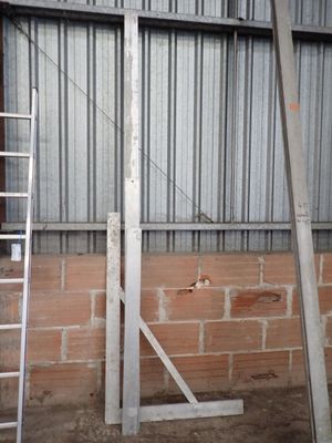 two ladders leaning against a wall in a building