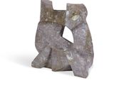 a sculpture of a cat made of stone on a white surface