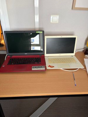 two laptops that are sitting on a desk