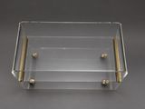clear acrylic box with brass handles and handles