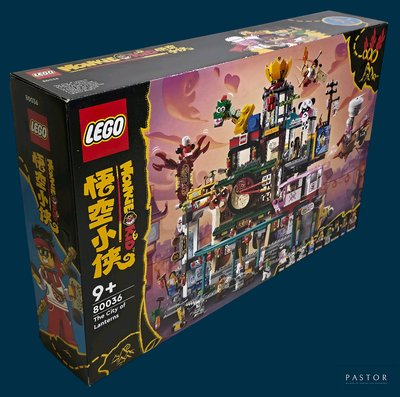a box of legos with a building inside of it
