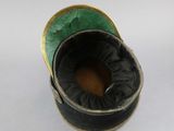 a black and green shoe with a gold trim
