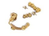 an image of a gold earring and a gold earring on a white background